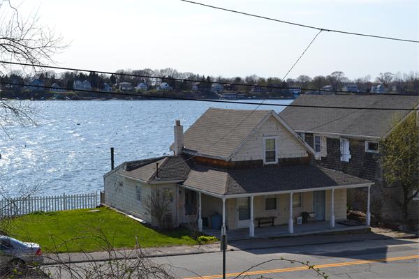 21 Riverside Drive Tiverton, RI 02878 - Photo 1 of 8 an aerial view of a house