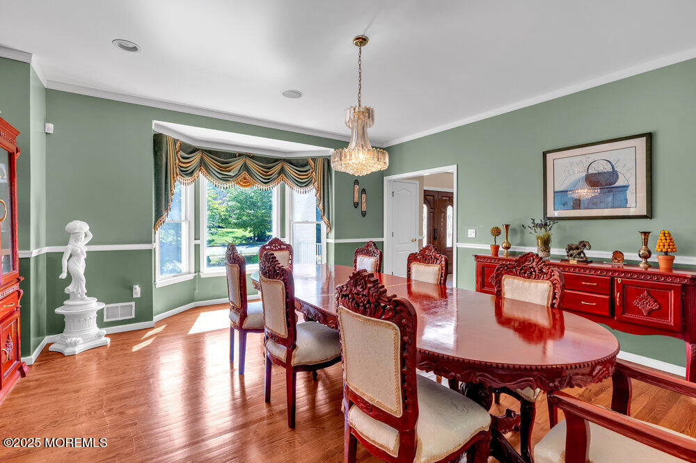 1721 Azure Drive Neptune, NJ 07753 - Photo 19 of 95 a view of a dining room with furniture window and wooden floor