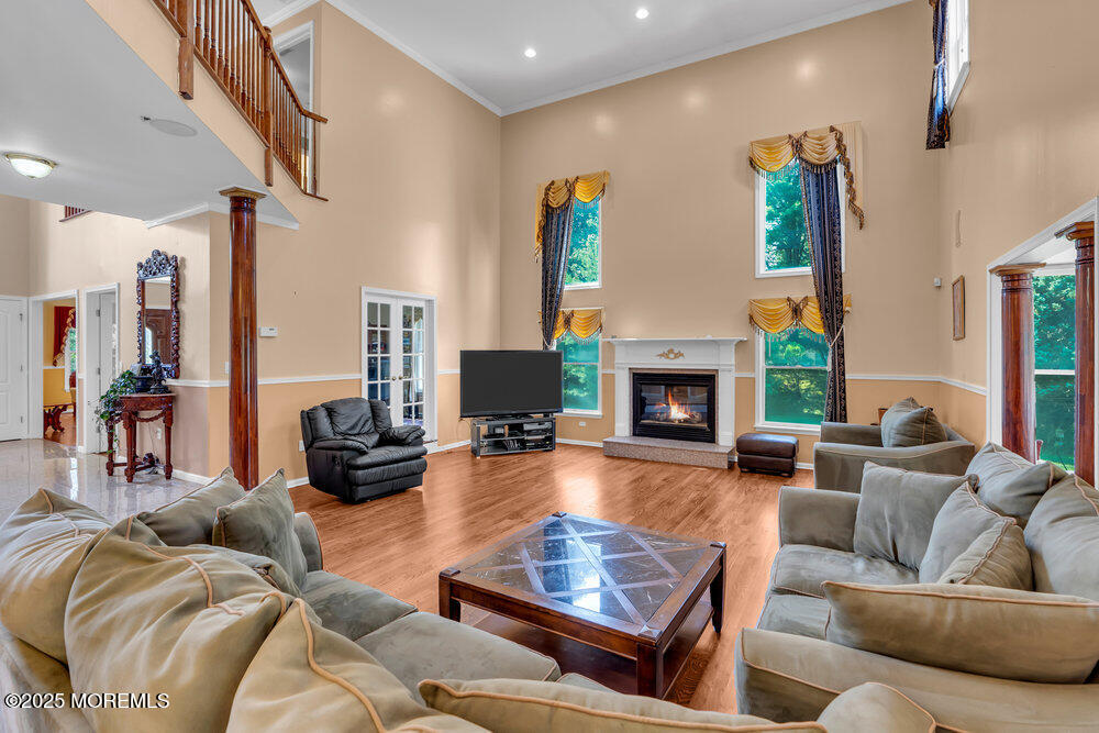1721 Azure Drive Neptune, NJ 07753 - Photo 2 of 95 a living room with furniture fireplace and a large window