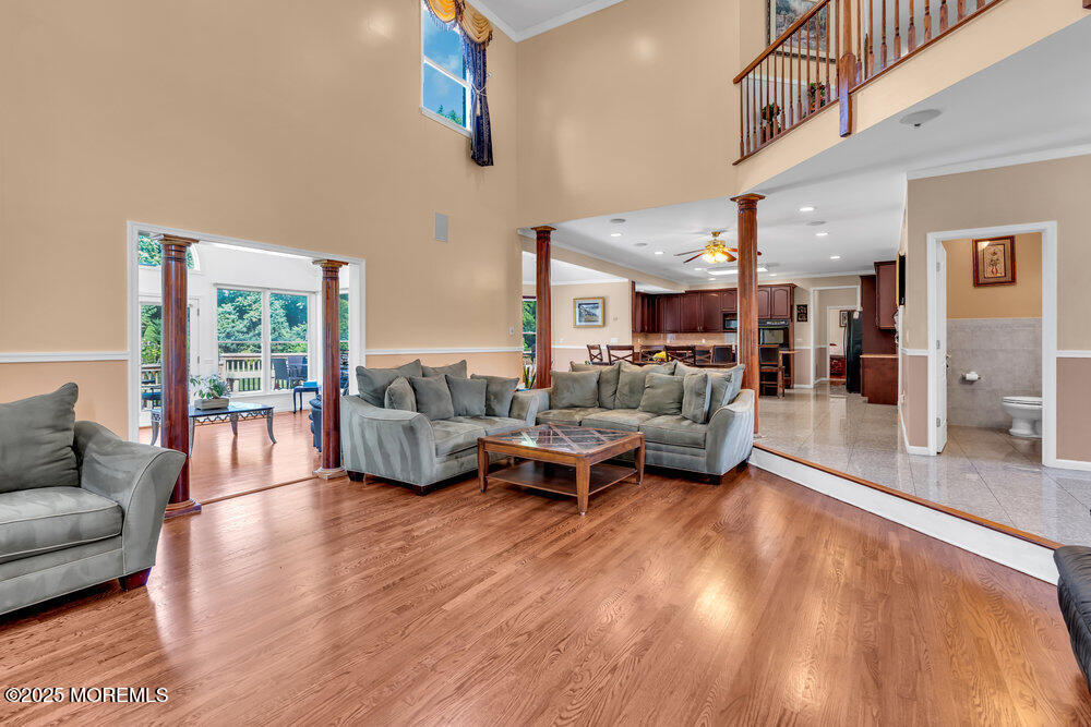 1721 Azure Drive Neptune, NJ 07753 - Photo 29 of 95 a living room with furniture and a wooden floor