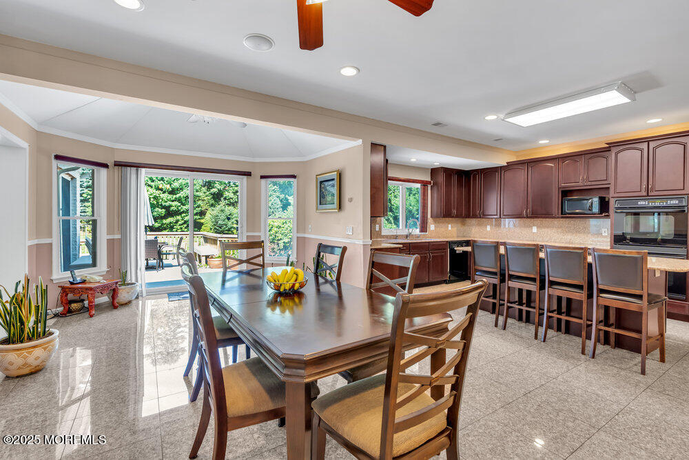 1721 Azure Drive Neptune, NJ 07753 - Photo 33 of 95 a view of a dining room with furniture and a potted plant
