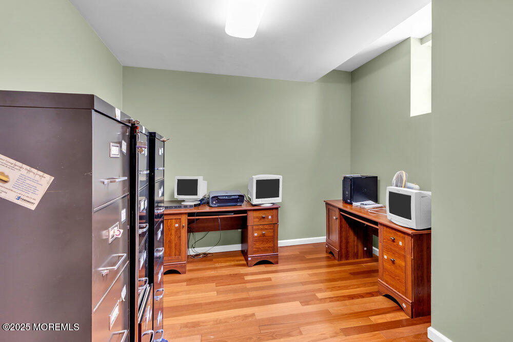 1721 Azure Drive Neptune, NJ 07753 - Photo 38 of 95 a view of a workspace with furniture and wooden floor
