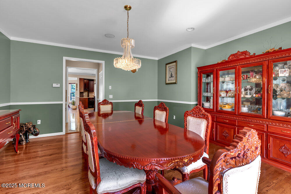 1721 Azure Drive Neptune, NJ 07753 - Photo 4 of 95 a view of a dining room with furniture wooden floor and chandelier