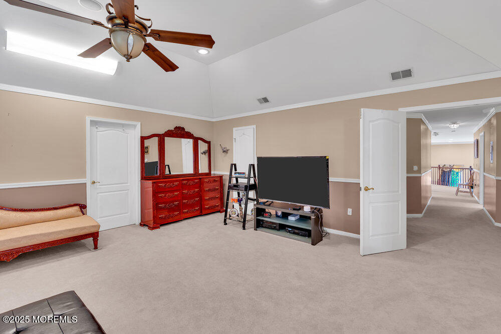 1721 Azure Drive Neptune, NJ 07753 - Photo 57 of 95 a bedroom with furniture and a flat screen tv