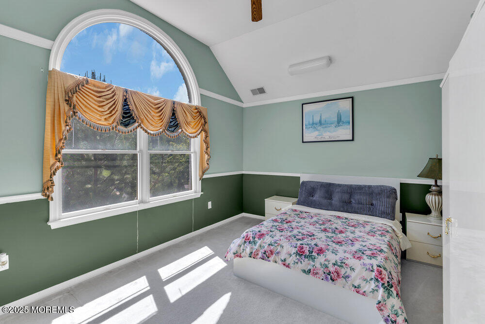 1721 Azure Drive Neptune, NJ 07753 - Photo 72 of 95 a bedroom with a bed and a painting on the wall