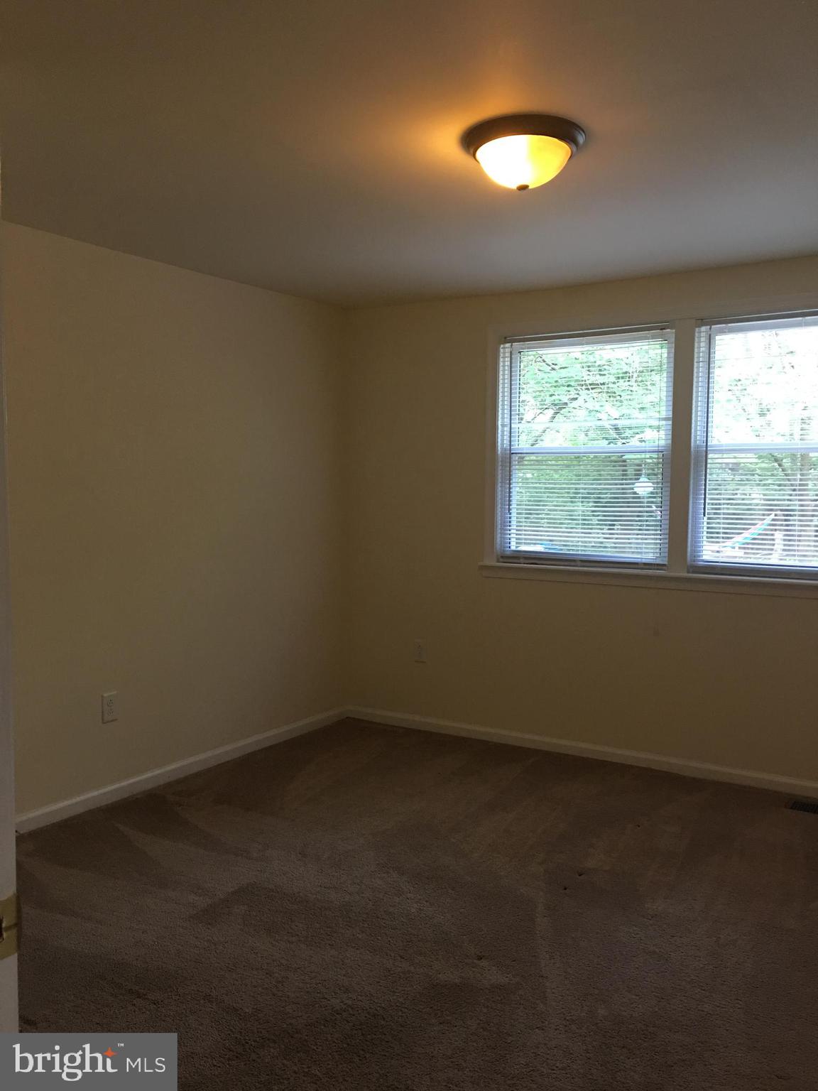 25 Zane Street, Unit A Glassboro, NJ 08028 - Photo 12 of 16 an empty room with a window
