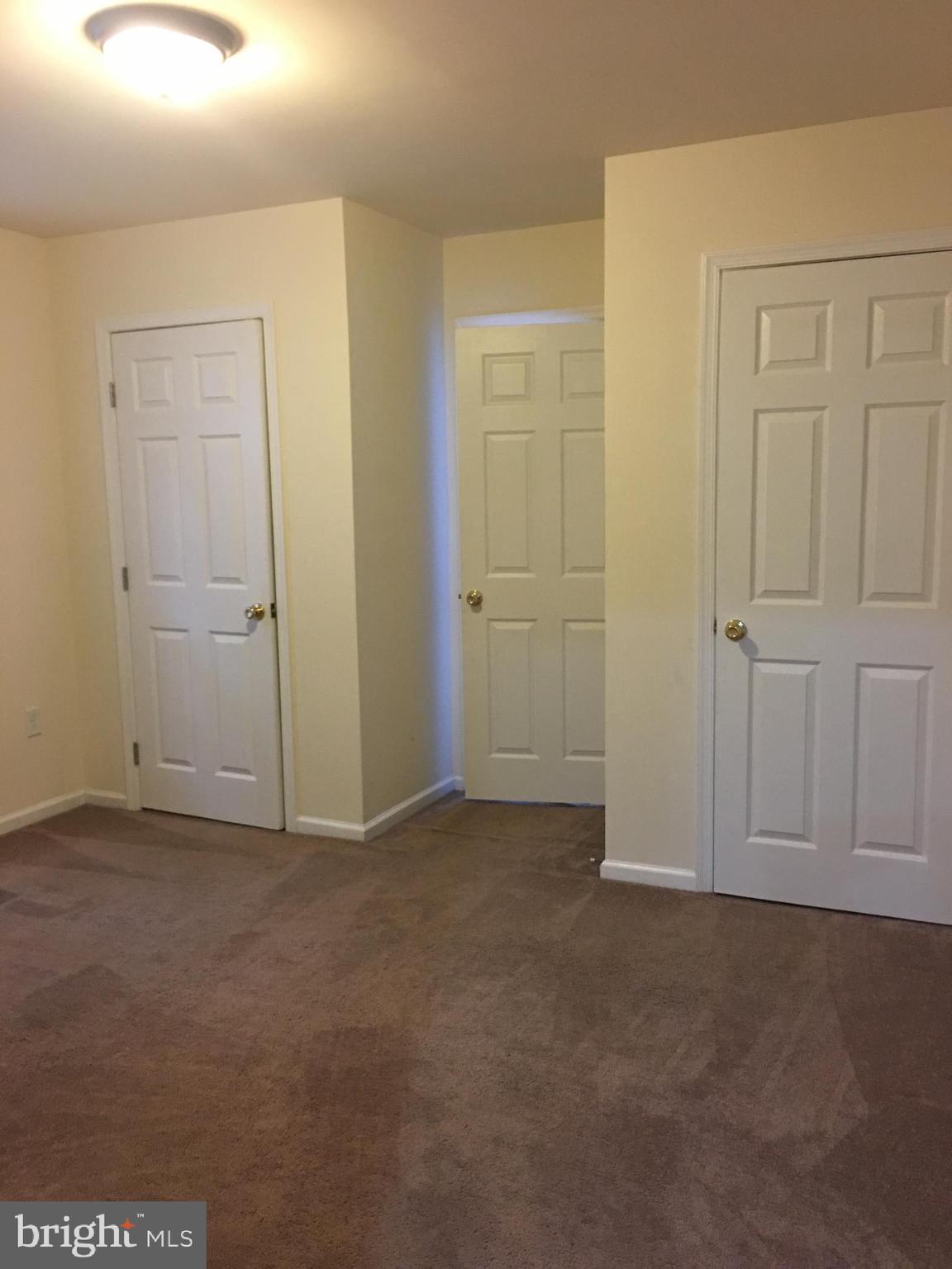 25 Zane Street, Unit A Glassboro, NJ 08028 - Photo 16 of 16 an empty room with closet area
