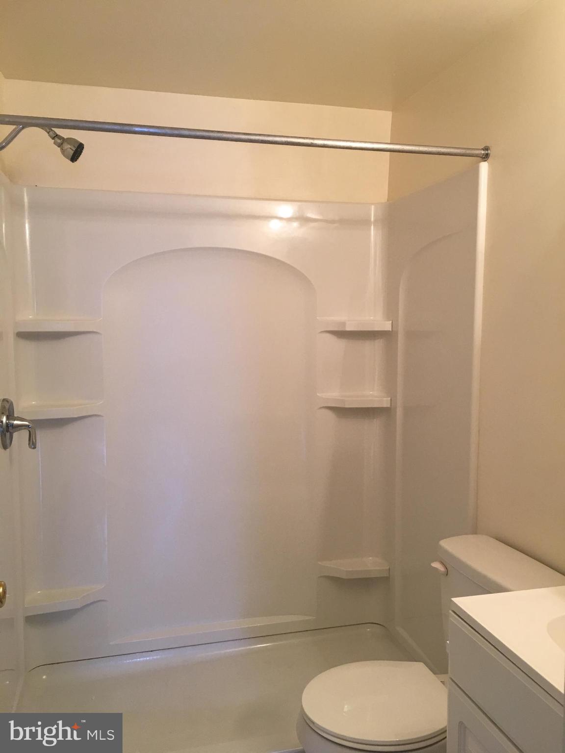 25 Zane Street, Unit A Glassboro, NJ 08028 - Photo 7 of 16 a bathroom with a toilet and a shower