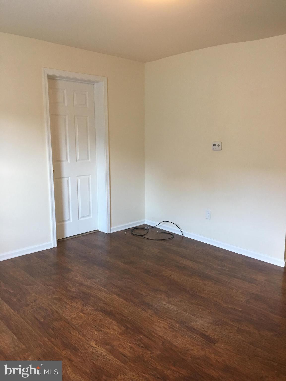 25 Zane Street, Unit A Glassboro, NJ 08028 - Photo 10 of 16 a view of empty room with wooden floor
