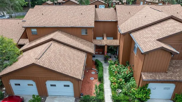 an aerial view of a house with a garden