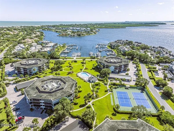 an aerial view of a house with outdoor space and lake view