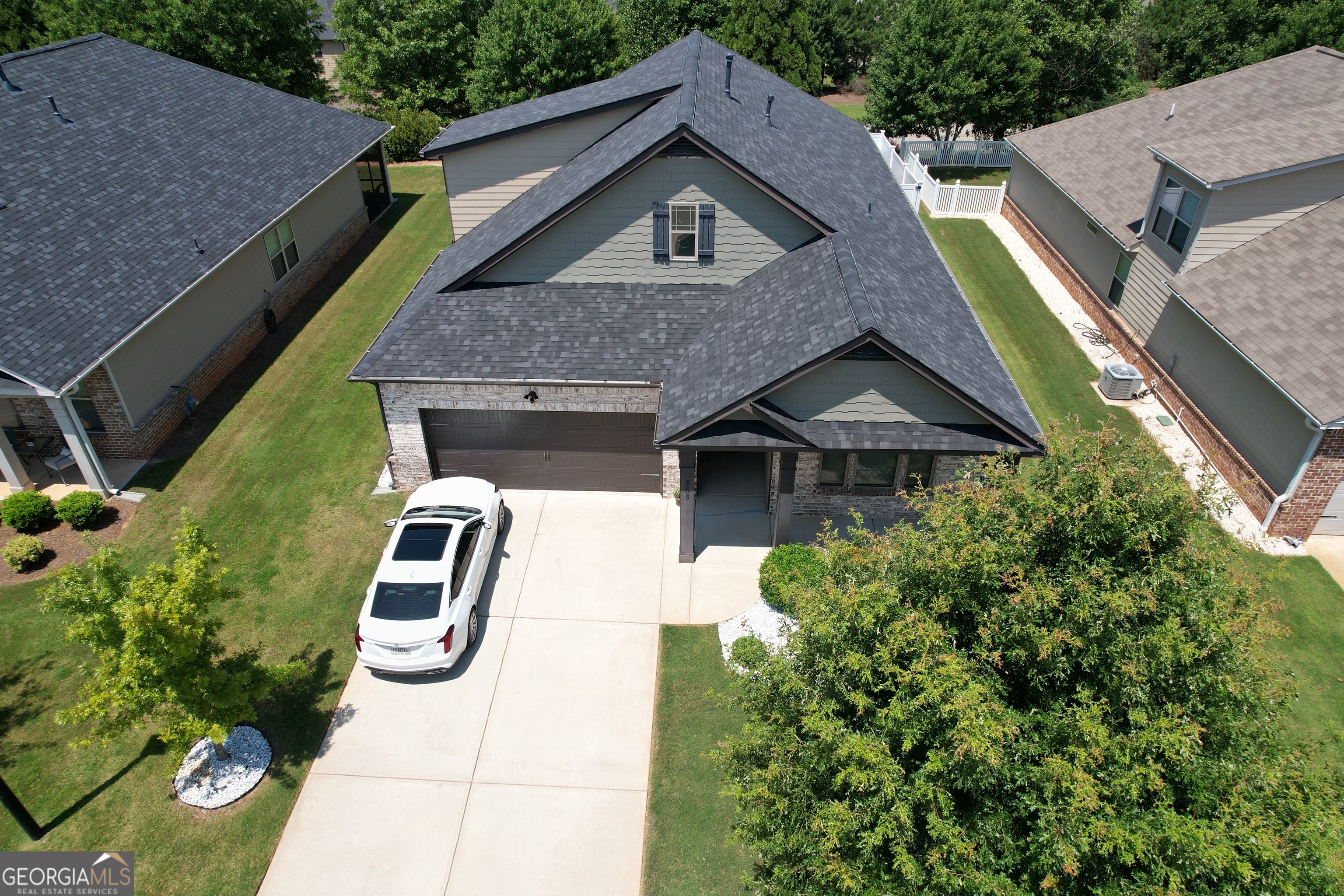 565 Carleton Place Locust Grove, GA 30248 - Photo 16 of 40 a aerial view of a house with a yard and potted plants