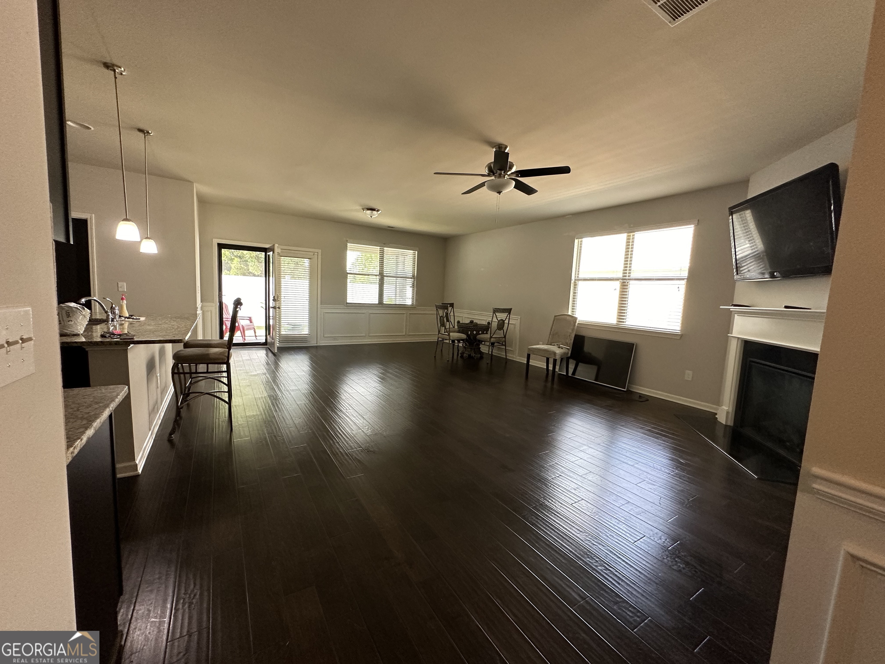 565 Carleton Place Locust Grove, GA 30248 - Photo 21 of 40 a view of a living room a couch and a flat screen tv