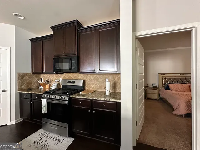 a view of a livingroom with furniture and a chandelier