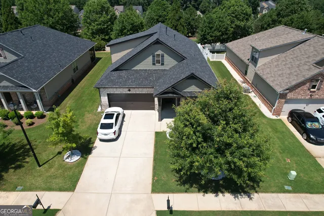 a aerial view of a house with a yard