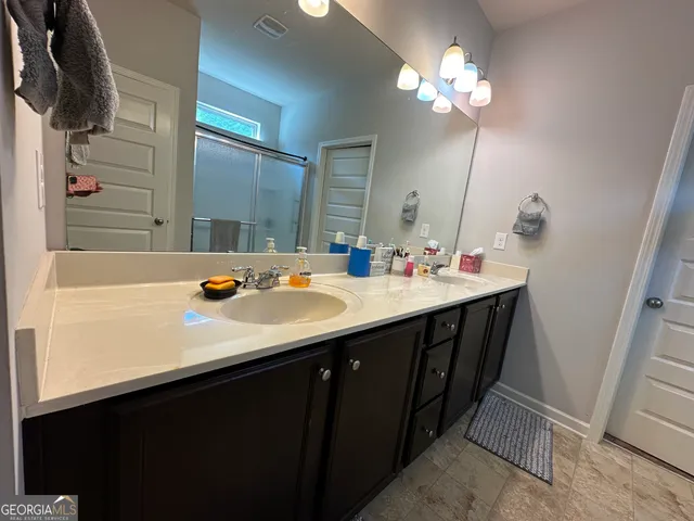 a bathroom with a shower and a toilet