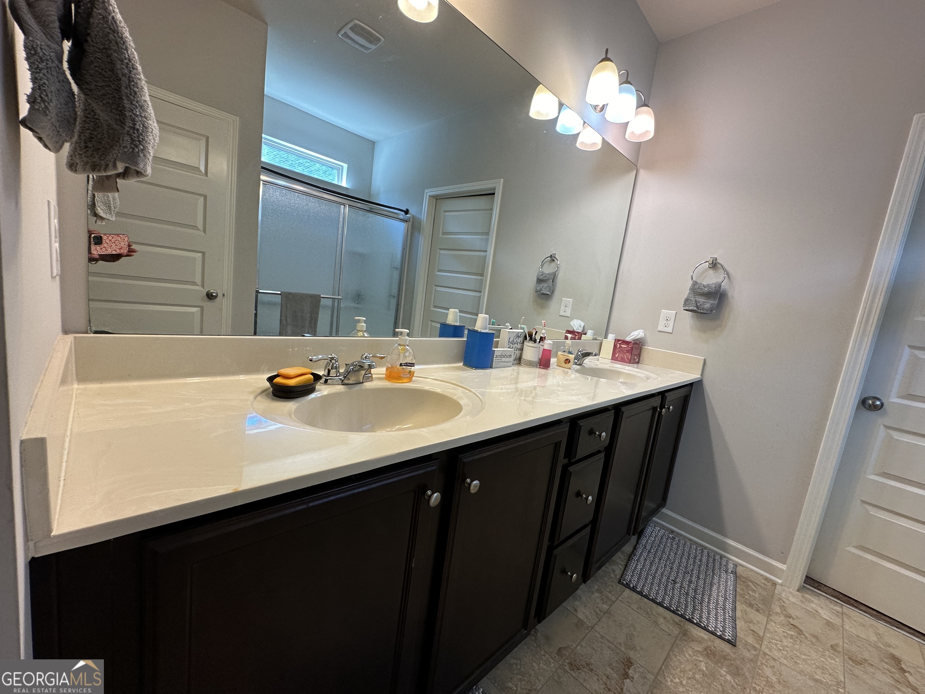 565 Carleton Place Locust Grove, GA 30248 - Photo 37 of 40 a bathroom with a sink double vanity and a mirror