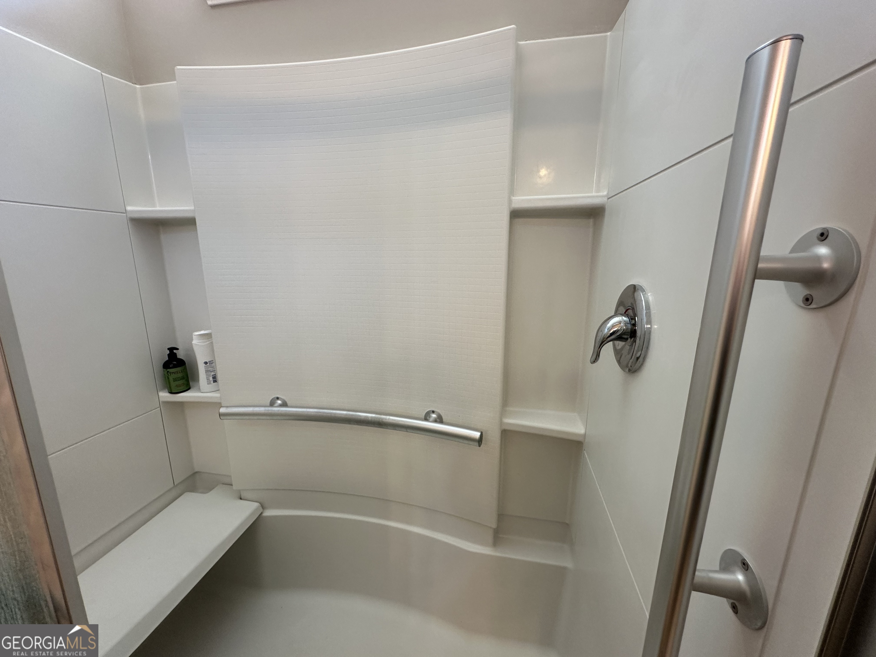 565 Carleton Place Locust Grove, GA 30248 - Photo 38 of 40 a bathroom with a shower and a toilet