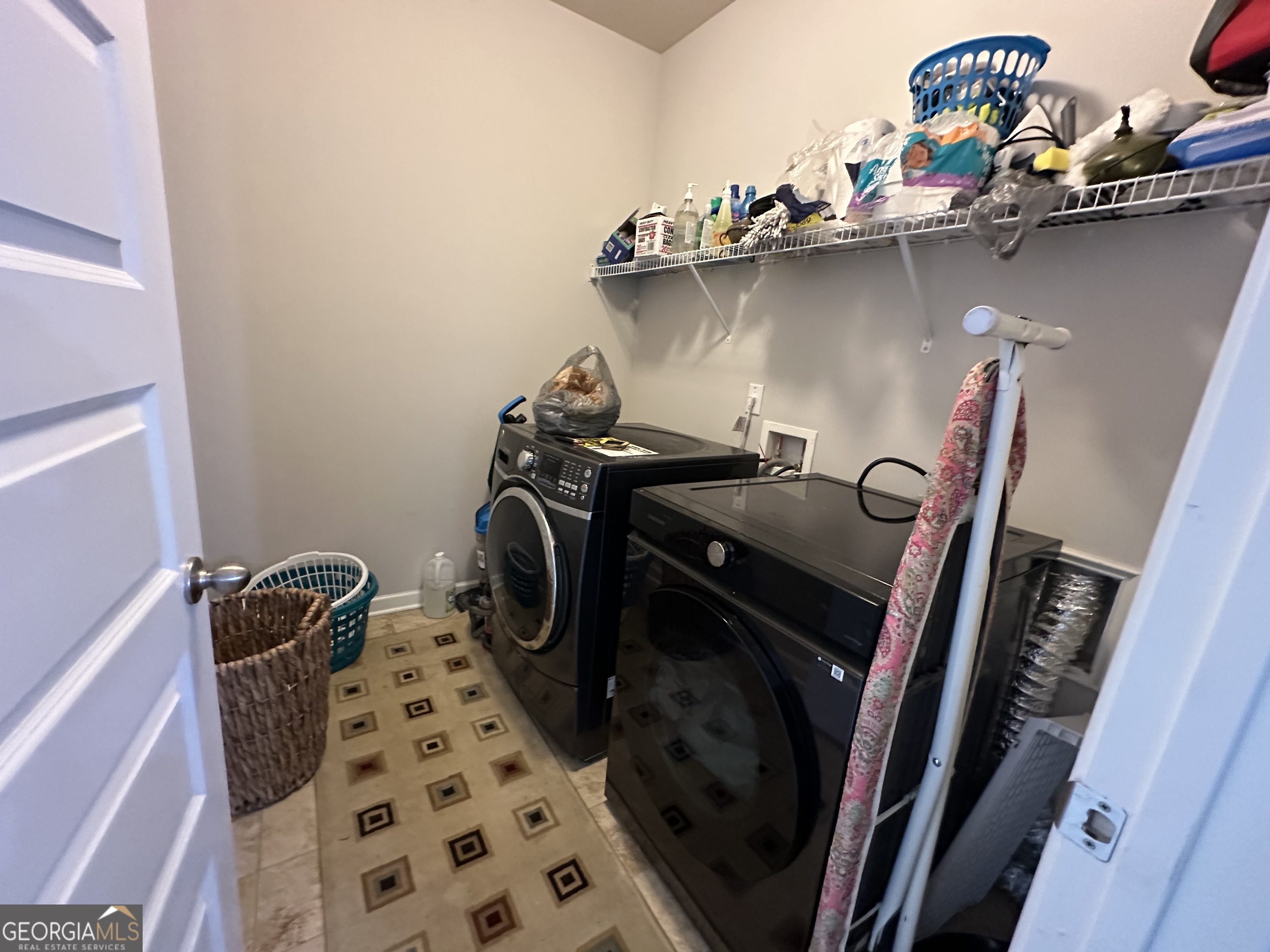 565 Carleton Place Locust Grove, GA 30248 - Photo 40 of 40 a close view of a washing machine