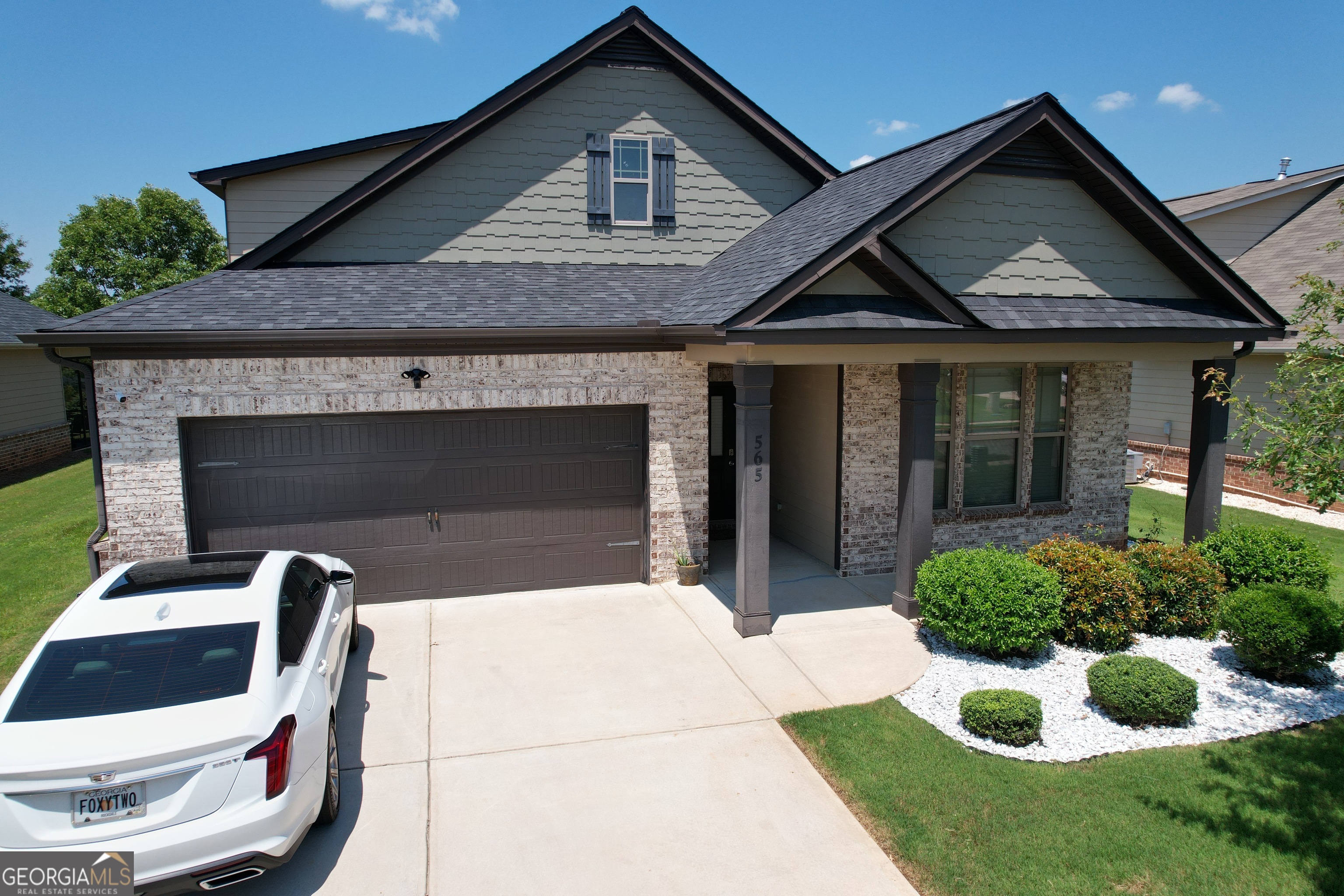 565 Carleton Place Locust Grove, GA 30248 - Photo 7 of 40 a front view of a house with garden