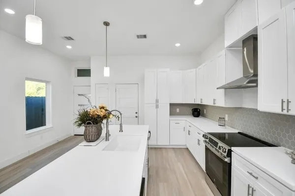 a view of a kitchen and a sink