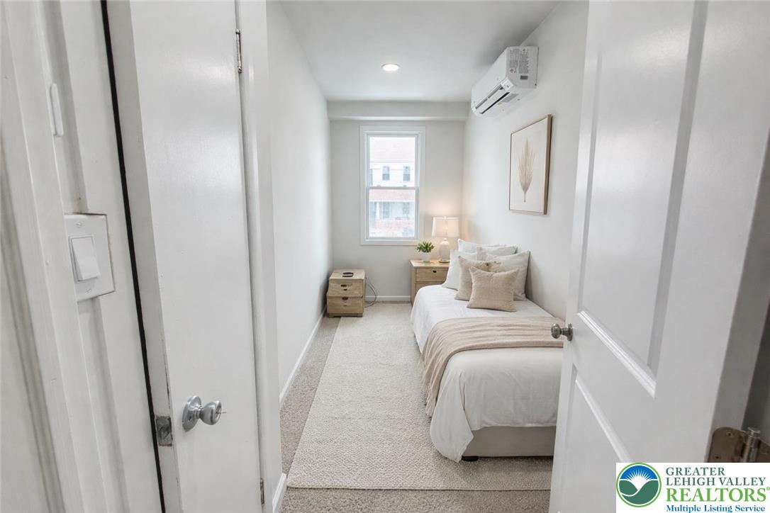 752 2nd Street Catasauqua, PA 18032 - Photo 11 of 23 a bedroom with a bed and a mirror