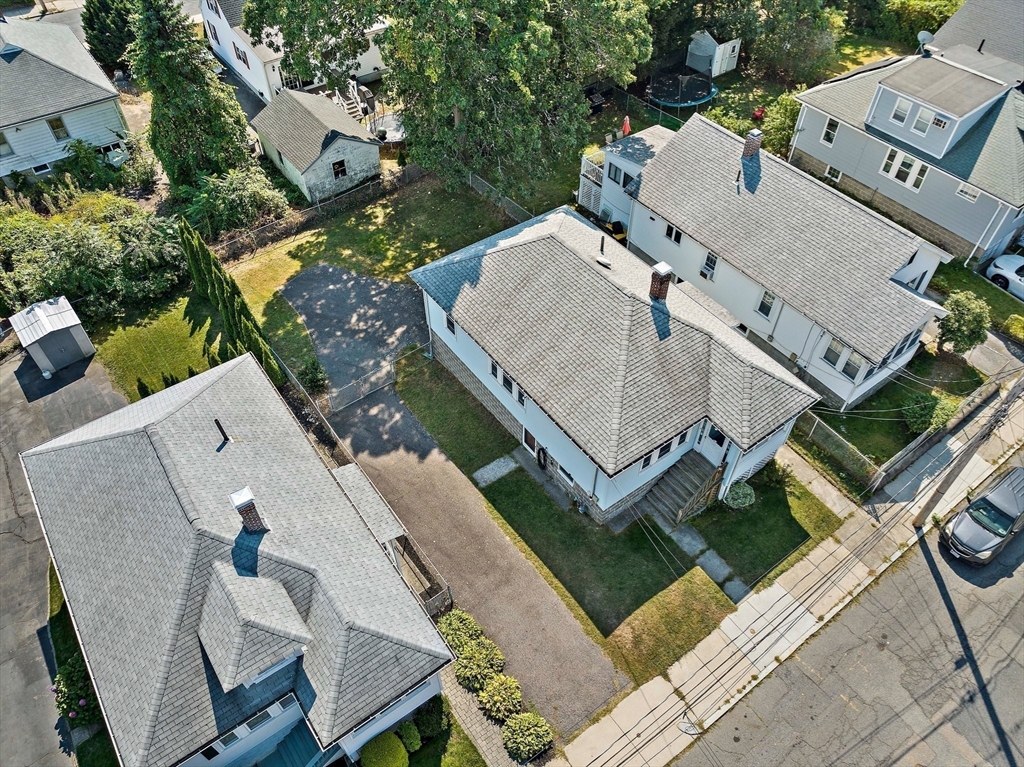 an aerial view of a house with outdoor space