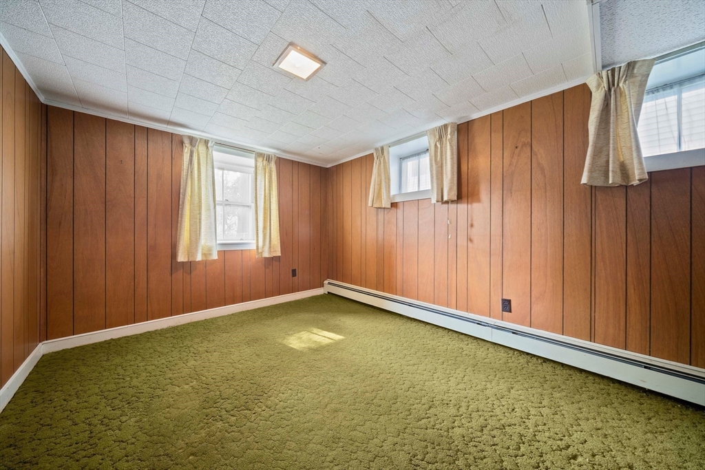 12 Cotuit Street Boston, MA 02132 - Photo 13 of 19 a view of an empty room with window and gate