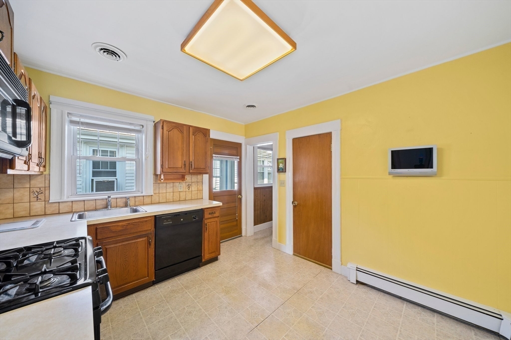 12 Cotuit Street Boston, MA 02132 - Photo 8 of 19 a large bathroom with a sink and a large mirror