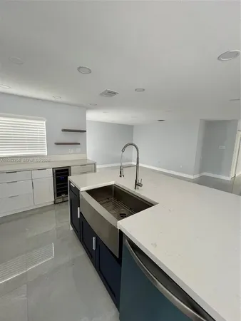 a kitchen with a stove and a sink