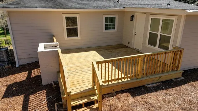 a view of a two chairs in the balcony