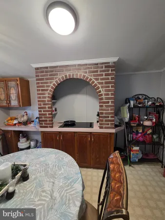 a kitchen with a wooden cabinets and a stove
