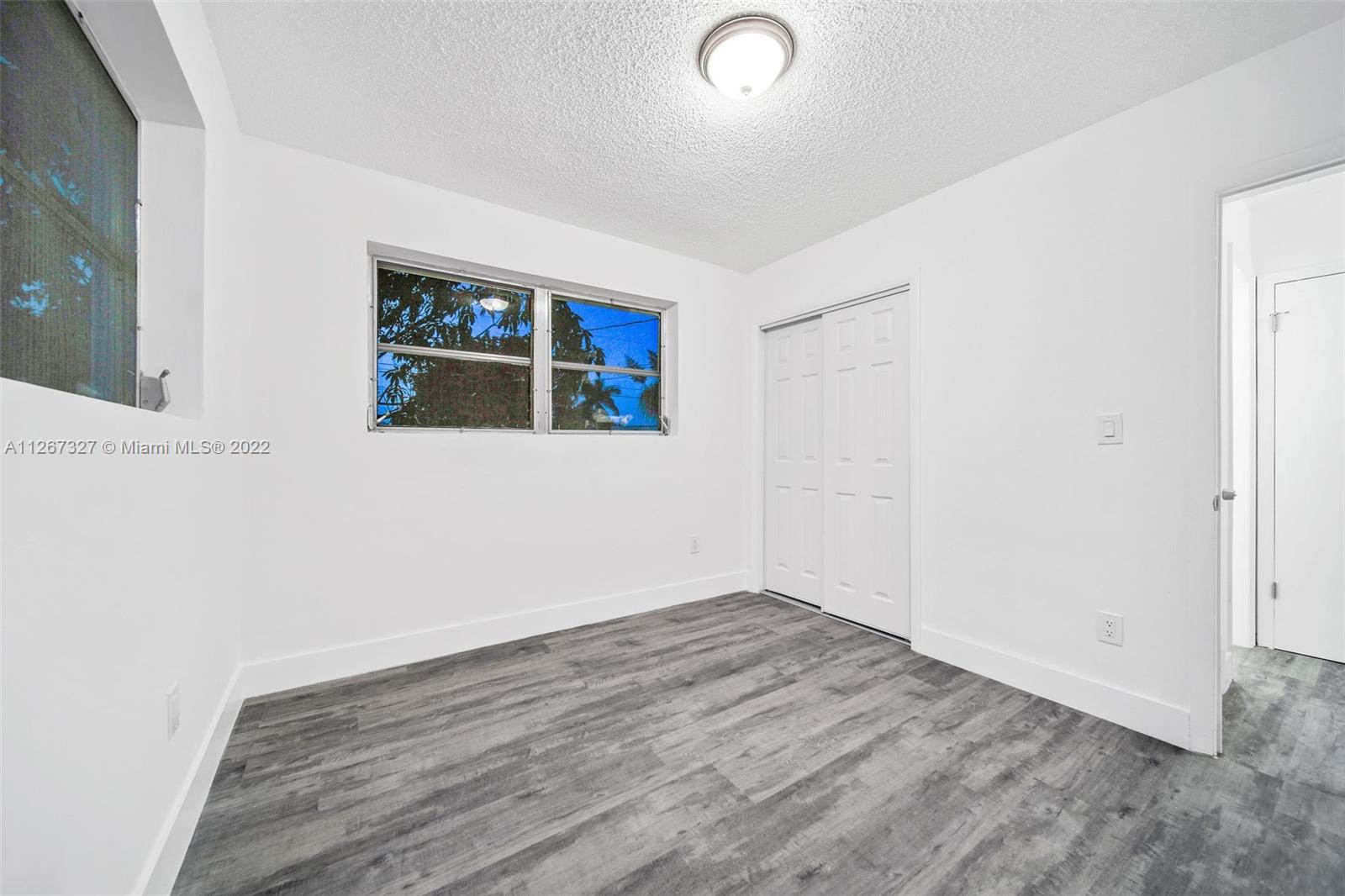 18951 Southwest 311th Street Homestead, FL 33030 - Photo 13 of 20 an empty room with a window