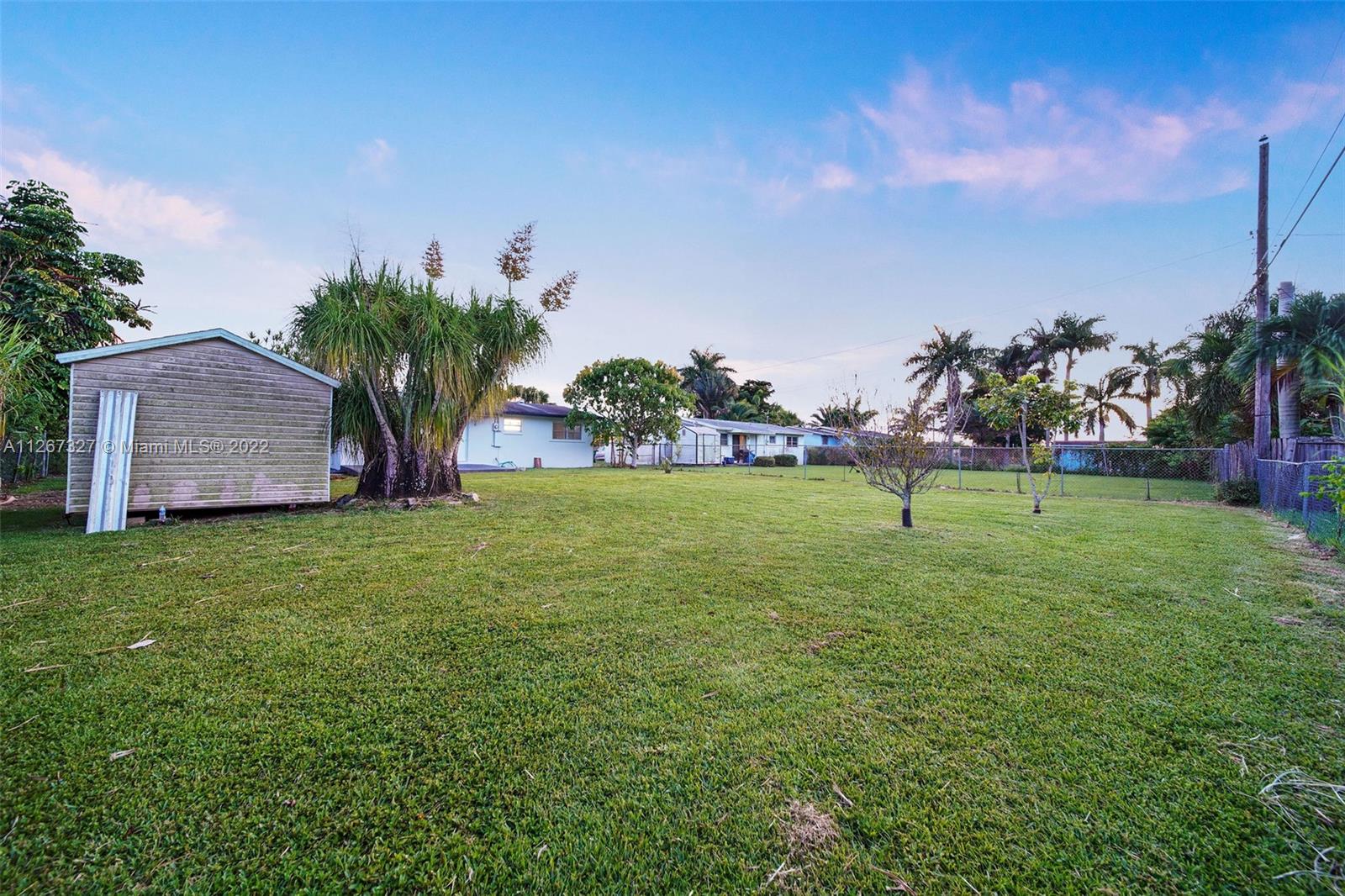 18951 Southwest 311th Street Homestead, FL 33030 - Photo 17 of 20 a garden view