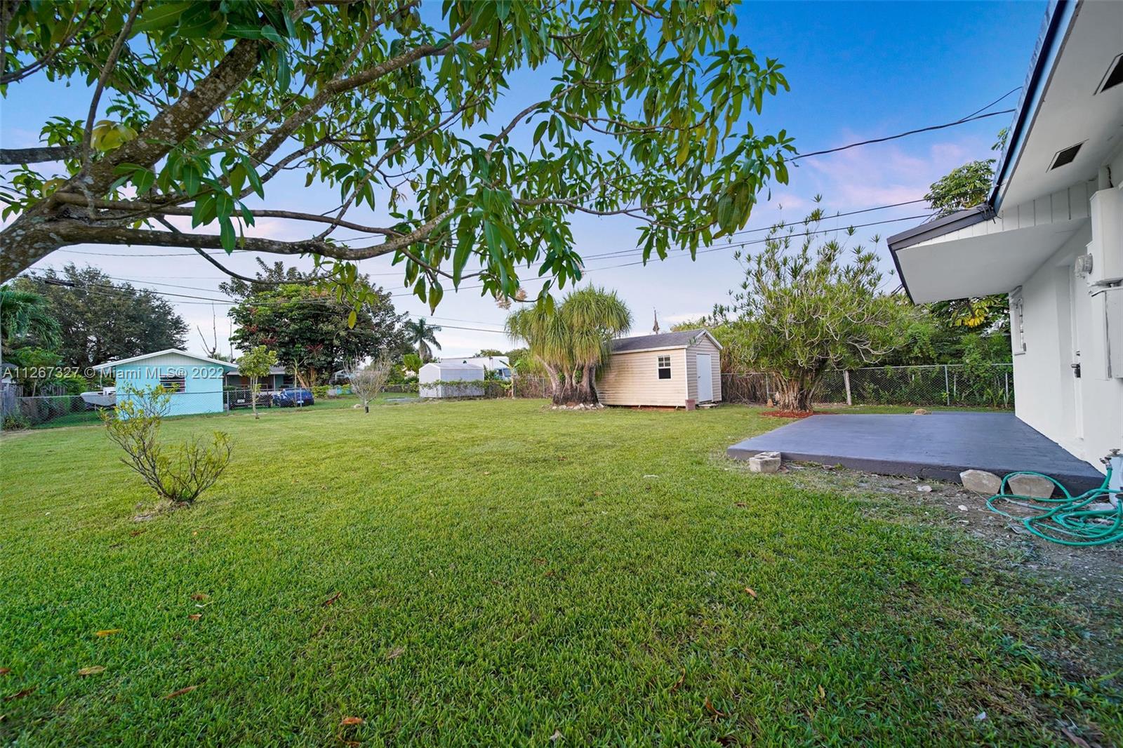 18951 Southwest 311th Street Homestead, FL 33030 - Photo 18 of 20 a view of a house with a yard