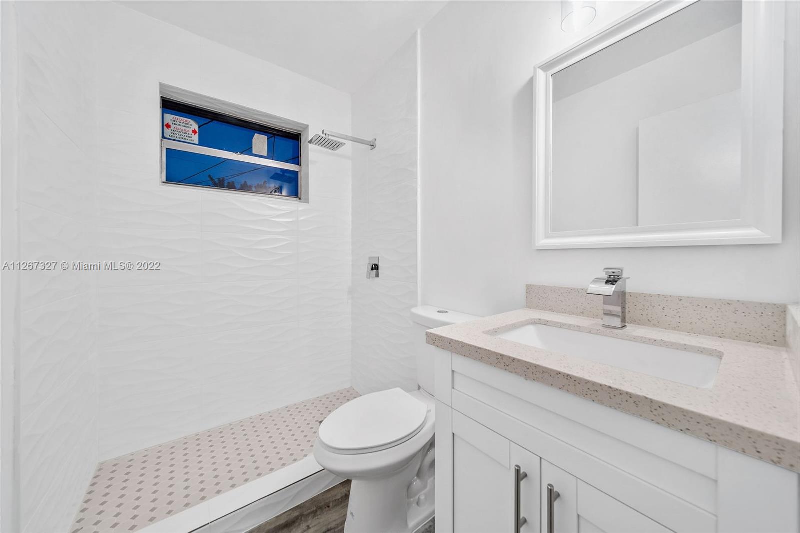 18951 Southwest 311th Street Homestead, FL 33030 - Photo 9 of 20 a bathroom with a sink and a toilet