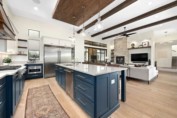 a large kitchen with stainless steel appliances kitchen island granite countertop a large counter top stainless steel appliances and cabinets