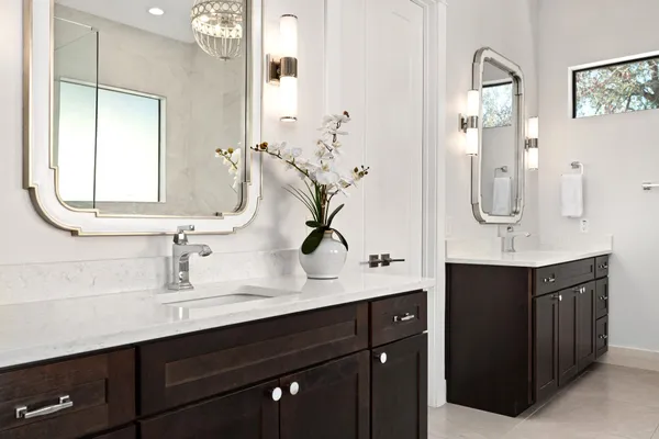 a bathroom with a tub shower and sink