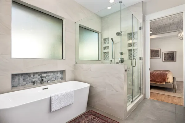 a room with pool table and windows