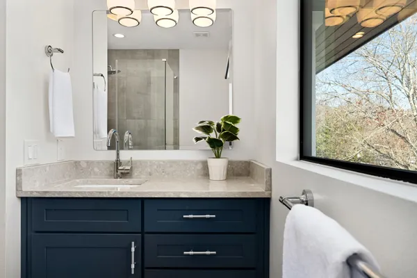 a living room with furniture and a floor to ceiling window