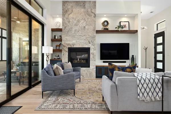 a living room with furniture and a fireplace