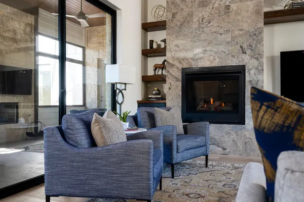 a living room with furniture and a fireplace