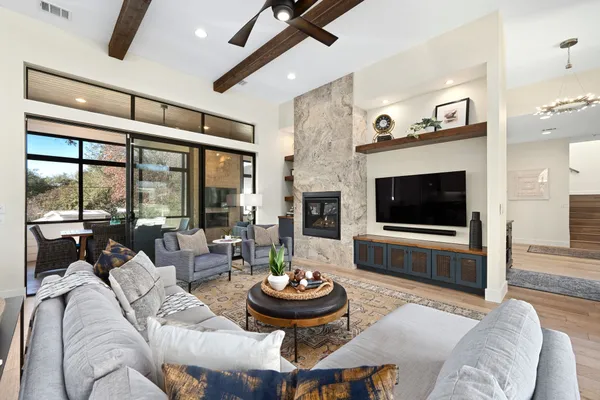 a living room with furniture and a flat screen tv