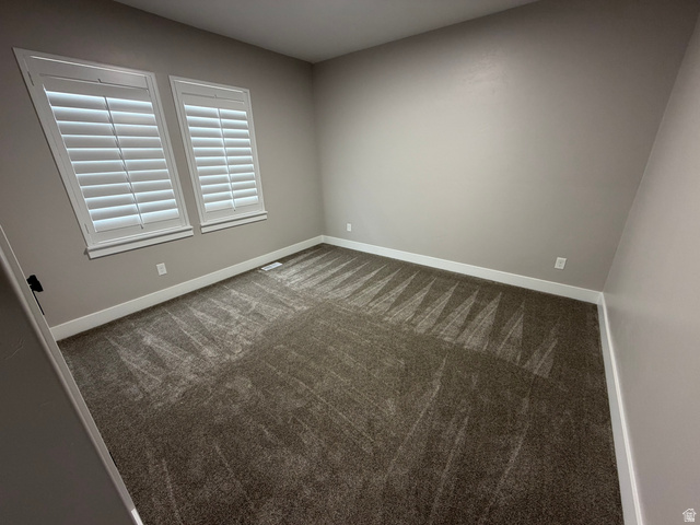 2350 North 1075 West Helper, UT 84526 - Photo 23 of 49 Carpeted spare room with baseboards