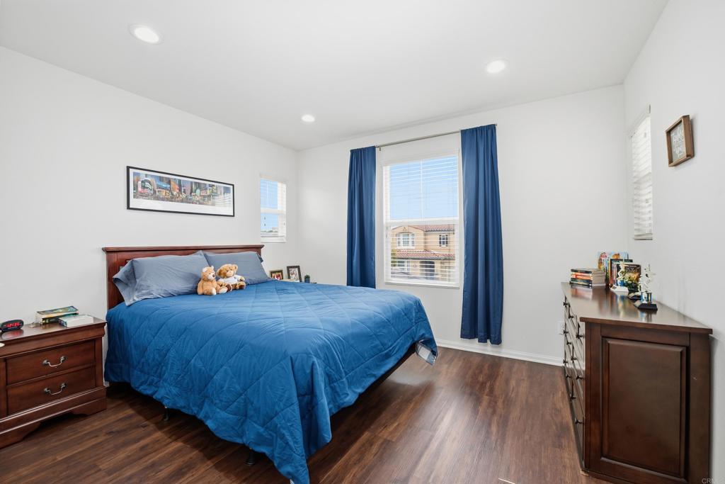 1746 Webber Way Chula Vista, CA 91913 - Photo 11 of 24 a bedroom with a bed and wooden floor