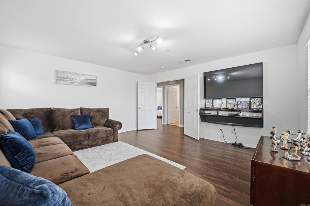 1746 Webber Way Chula Vista, CA 91913 - Photo 12 of 24 a living room with furniture and a flat screen tv