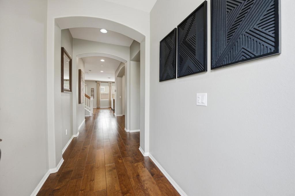1746 Webber Way Chula Vista, CA 91913 - Photo 4 of 24 a view of a hallway with wooden floor and staircase