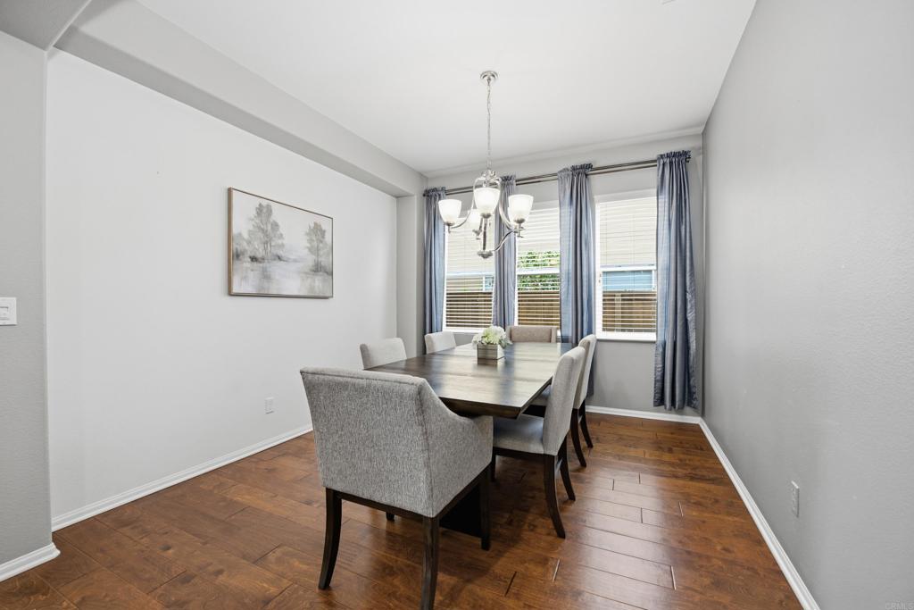 1746 Webber Way Chula Vista, CA 91913 - Photo 5 of 24 a view of a dining room with furniture window and wooden floor