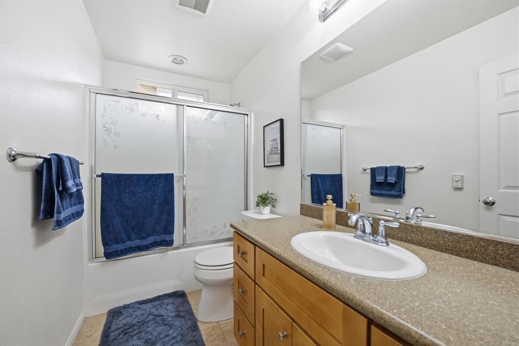 1746 Webber Way Chula Vista, CA 91913 - Photo 10 of 24 a bathroom with a granite countertop sink toilet and shower