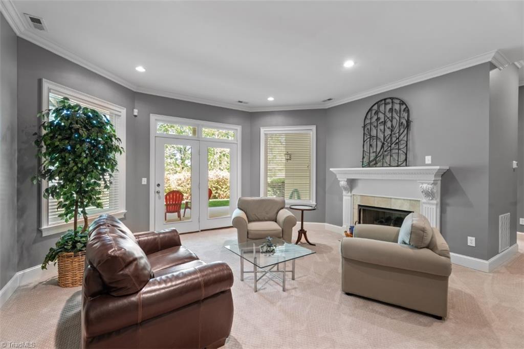 4449 Bent Tree Farm Road Winston-Salem, NC 27106 - Photo 36 of 50 Den with a fireplace and glass door to the covered patio